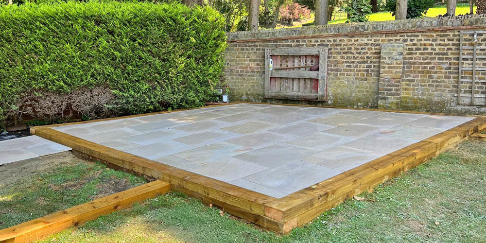 Indian sandstone patio, view from lawn Raised Indian Sandstone Patio, Royal Tunbridge Wells. Award-Winning Paving